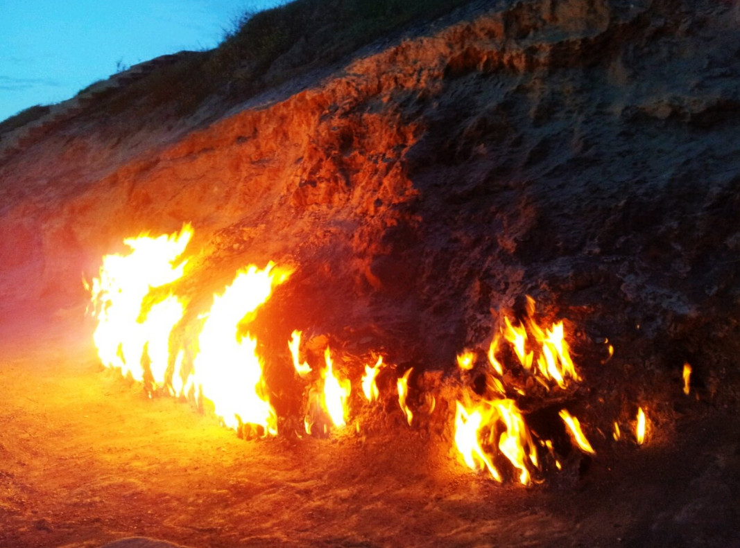 Flames at the Sacred Fires of Absheron site at sunset