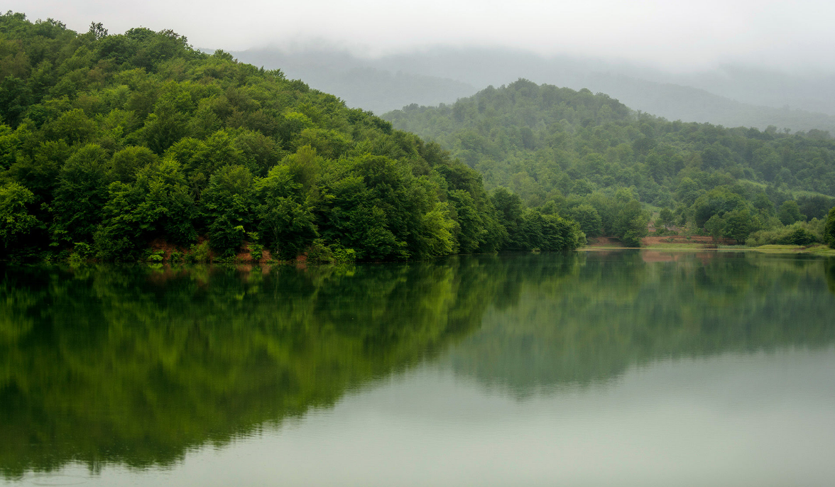 Scenic view of Chenlibel Lake surrounded by greenery